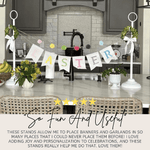 Tabletop banner stand displaying a lightweight wreath centerpiece