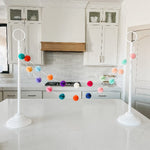 Tabletop garland stand on entry table for everyday décor